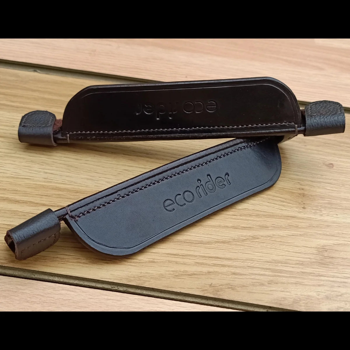 Brown EcoRider FEI Compliant Leather Blinkers separates pair featuring secure velcro cheekpiece attachments.
