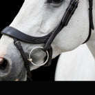 Close-up of the white decorative fancy stitching on a black EcoRider anatomic leather noseband, showing the bit ring on a grey horse.