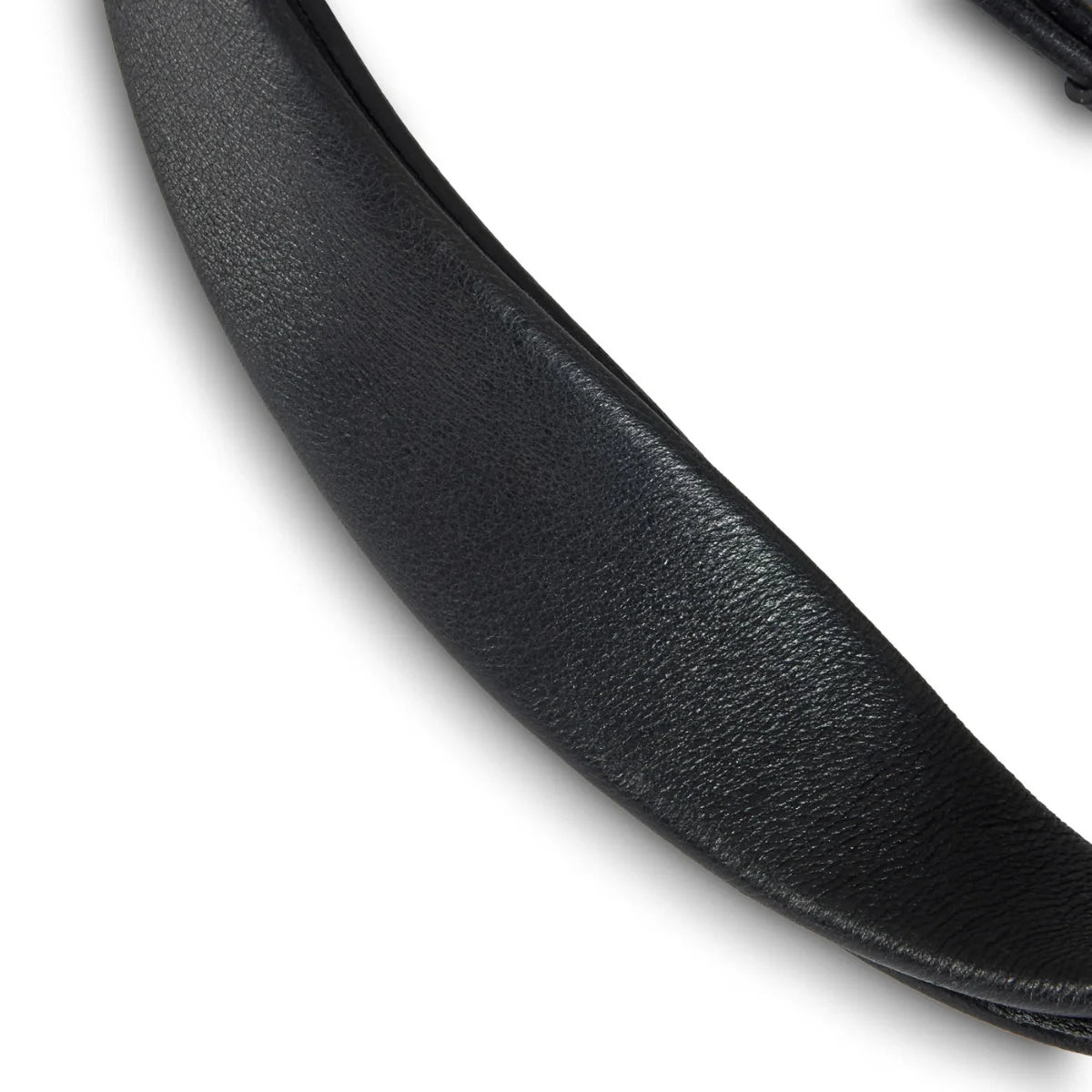 Close-up view of the supple, grain-textured black leather on an EcoRider Ultra Comfort padded bridle component.