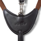 Close-up of the debossed EcoRider logo on the padded chest plate and brown elastic straps of the black Tara Breastplate.