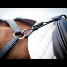 Close-up of the black EcoRider leather breastplate attached to the saddle pommel, displaying fancy stitching and stainless steel rings.